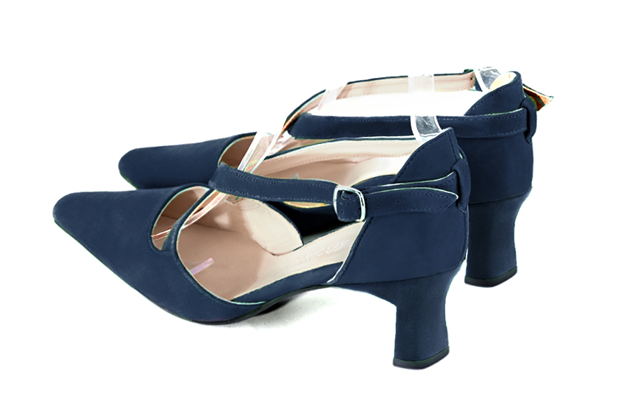 Women's navy blue open side dress shoes, with crossed straps. Tapered toe. Medium spool heels - Rear view